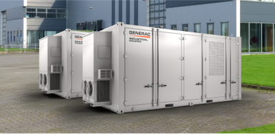 Two commercial generator enclosures outside an office building