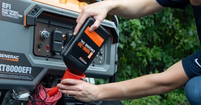 Engine oil being poured into a portable generator