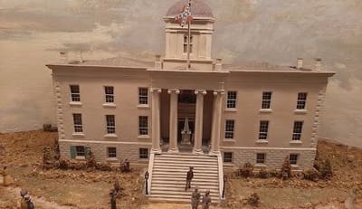 Classical-style historic building with columns and a domed cupola